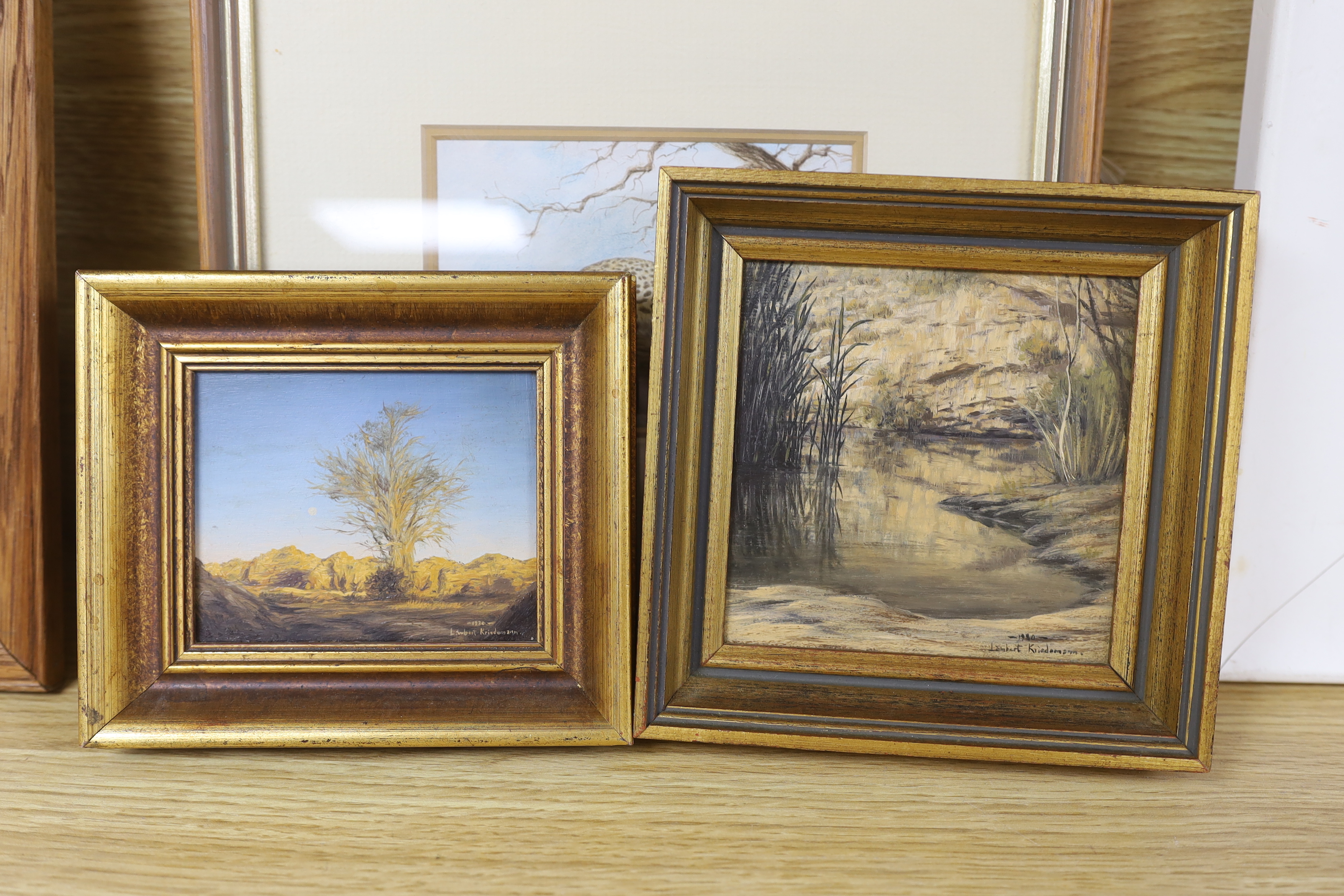 Lambert Kariedemann (South African, b.1951), pair of watercolours, Leopards and antelopes, together with two miniature oils by the same artist, landscapes, each signed, largest 9 x 12.5cm